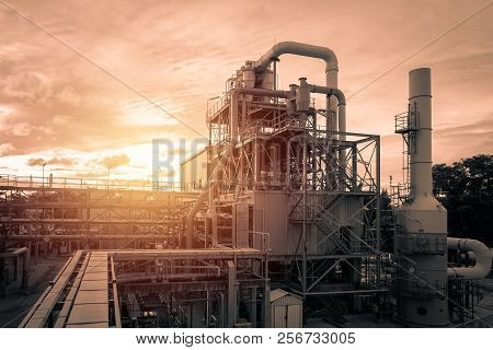 Pipeline And Pipe Rack Of Industrial Plant With Sunset Sky Background, Manufacturing Of Polymer Indu