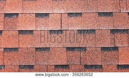 Close Up View On Asphalt Roofing Red Shingles Background. Roof Bitumen Shingles - Roofing Constructi