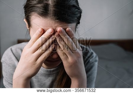 Close Up Images Of Thoughtful Insecure Young Woman Touching Forehead Having Headache Migraine Or Dep