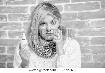 Nasal Spray Runny Nose Remedy. Girl Sick Person Hold Nasal Drops And Tissue. Allergy Concept. Home T