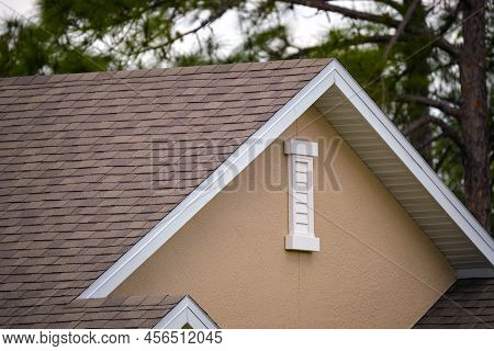 Closeup Of House Roof Top Covered With Asphalt Or Bitumen Shingles. Waterproofing Of New Building