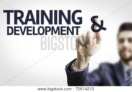 Business man pointing to transparent board with text: Training & Development