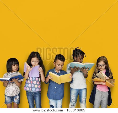 Diverse Group Of Kids Study Read Book