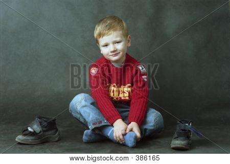 Boy Sitting On The Floor