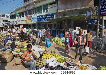 People walk by the local market in Bandarban, Bangladesh.