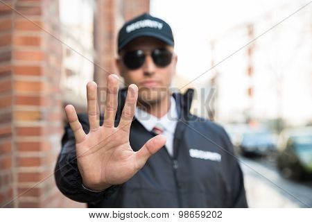 Security Guard Making Stop Sign