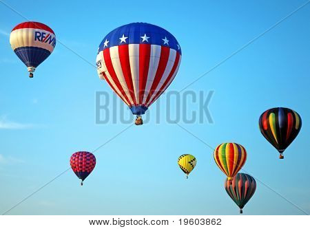 WHITESHOUSE STATION, NJ-JULY 25: Hot air balloons fly during the 26th annual Hot Air Balloon Festival July 25, 2008 over Whitehouse Station, NJ.  Approximately 125 balloons took part in the festival.