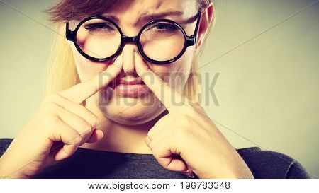 Girl Pinches Her Nose Because Of Stench Stink.