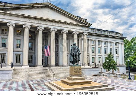 Albert Gallatin Statue US Flag US Treasury Department Washington DC. Statue by James Fraser and dedicated in 1947.