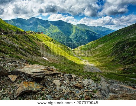 Mountain landscape. Carpathian Mountains in Romania. Cliffs nearby Transfagarasan road. High mountain peaks. reen mountain valley. Scenic landscape. Romania. Place for active recreation and hiking