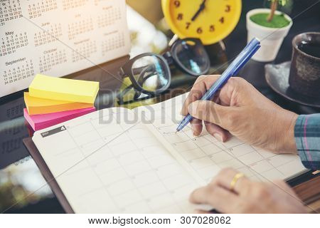 On 2019 Calendar Page,female Hand Planner Or Organizer Writing Daily Appointment.woman Mark And Note