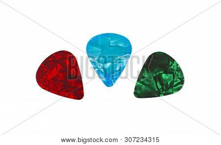 Three Colorful Pearl Guitar Plectrum Picks, Green, Blue, Red, Isolated On White Background