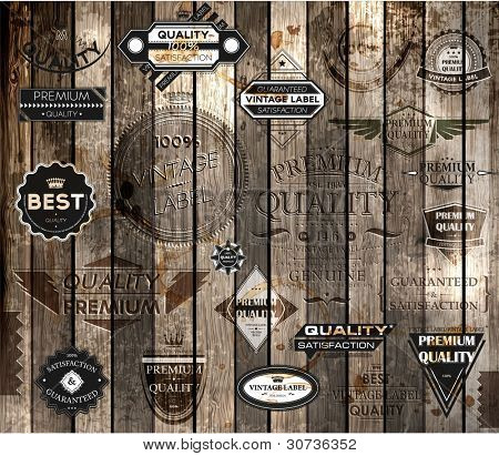 vector set of calligraphic design elements, page decoration, Premium Quality and Satisfaction Guarantee Label collection, Vintage wood background