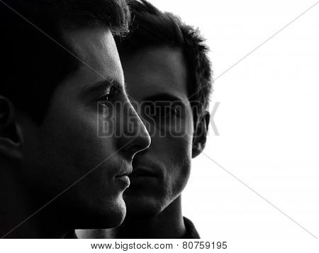 close up portrait two  young men in shadow white background