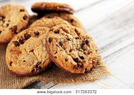 Chocolate Cookies On Wooden Table. Chocolate Chip Cookies Shot On Wooden White Table