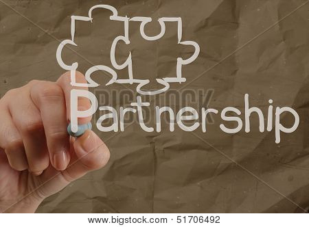 Hand Drawing Partnership Puzzle With Crumpled Recycle Paper Background