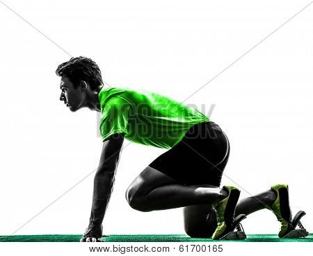 one caucasian man young sprinter runner in starting blocks silhouette studio on white background