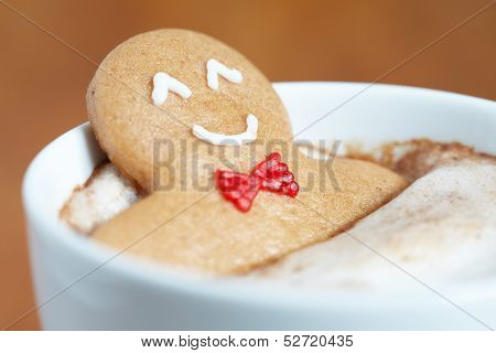 Gingerbread man in hot chocolate