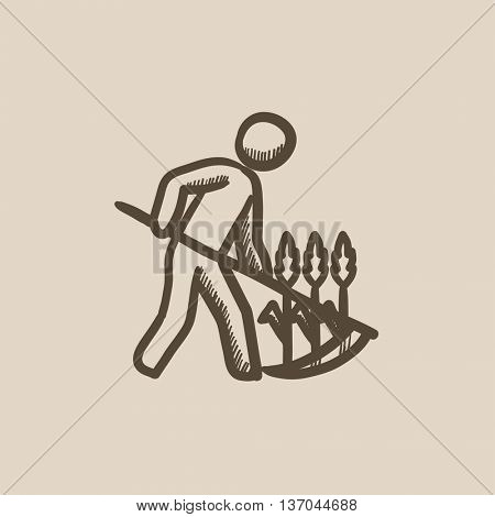 Man mowing grass with scythe vector sketch icon isolated on background. Hand drawn Man mowing grass with scythe icon. Man mowing grass with scythe sketch icon for infographic, website or app.