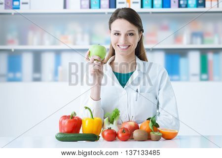 Smiling Nutritionist In Her Office