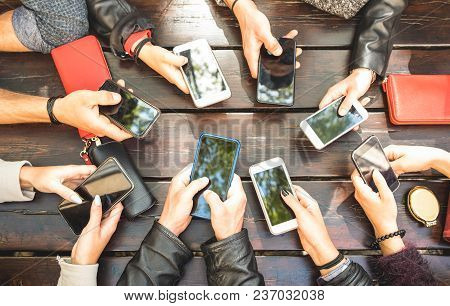 People Group Having Addicted Fun Together Using Smartphones - Detail Of Hands Sharing Content On Soc