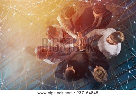 Business People Putting Their Hands Together In Office With Internet Network Effects. Concept Of Int