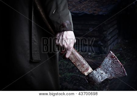 Axe With Blood In Male Hand