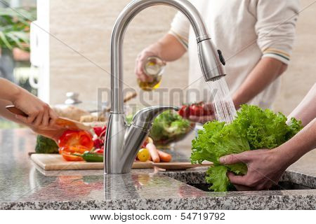 Family Cooking A Dinner Together