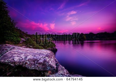 Violet Sunset Over A Calm Lake