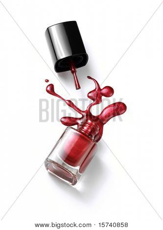 nail polish in glass bottle isolated on white background. liquid splash. nail polish drop