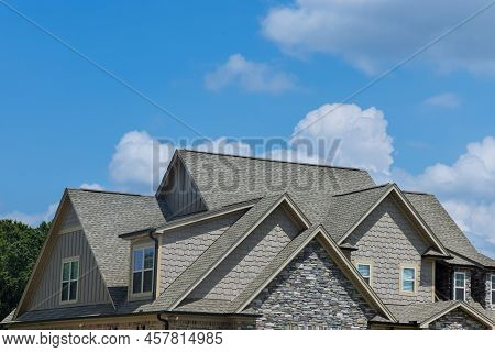 Roof Construction Of A Building Roof That Is Covered With New Asphalt Shingles