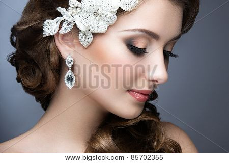 Portrait of a beautiful woman in a wedding dress in the image of the bride. Beauty face