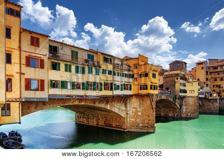 Side View Of Medieval Bridge Ponte Vecchio In Florence, Italy