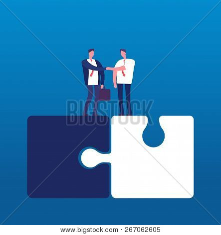 Businessmen With Puzzle. Man Handshaking On Huge Puzzles. Partnership Cooperation And Success Teamwo