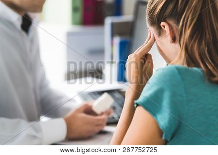 Doctor Giving Medical Help To Sick Patient With Bad Headache Or Migraine. Physician Or Pharmacist Ho