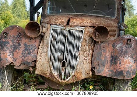 Mozhaisk, Russia - August 11, 2019: Old Abandoned Rusty Vehicles, Crushed Cars In Scrapyard, Junk Ya