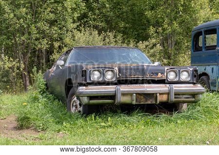 Mozhaisk, Russia - August 11, 2019: Old Abandoned Rusty Vehicles, Crushed Cars In Scrapyard, Junk Ya