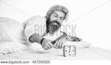 Time Management. Time To Wake Up. Exhausted Man Being Awakened By Alarm Clock In Bedroom. Mature Man