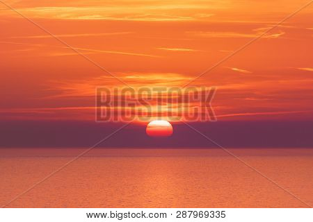 Sunset Over The Sea Horizon Nature Landscape. Red Clouds And Sea Landscape. Sea Nature In Sunset. Na