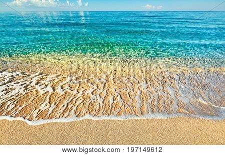 Sea view from tropical beach with sunny sky. Summer paradise beach. Tropical shore. Tropical sea. Exotic summer beach with clouds on horizon. Ocean beach relax outdoor travel