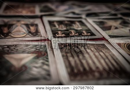 Closeup Of Occult Mystic Tarot Deck And Old Tarot Cards Laying On Table For A Magical Pagan Psychic 