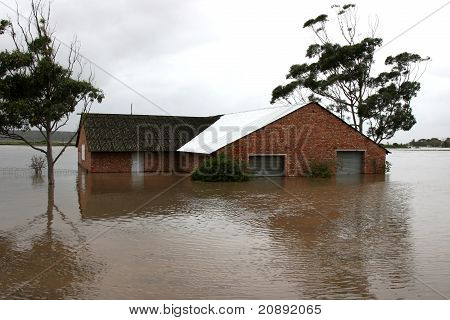 Flooded House On River Bank