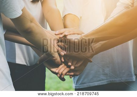 Team teamwork business join hand together concept Power of volunteer charity work Stack of people hand