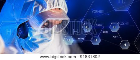 science, chemistry, biology, medicine and people concept - close up of scientist face in goggles and protective mask at chemical laboratory over hydrogen chemical formula