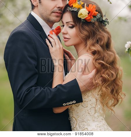 The bride and groom - photo in a flowery Park in the spring.