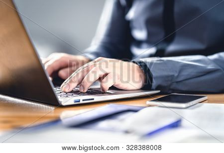 Man Writing With Laptop. Smart Hipster Guy With Finance, Market And Business Expertise. Freelance Wo