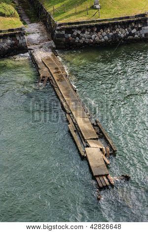 Broken bridge near the water