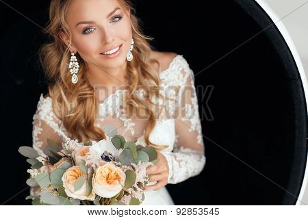 Young attractive bride with a wedding bouquet