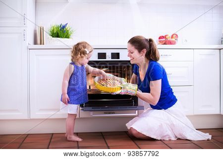 Mother And Child Baking A Cake.