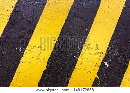 Grunge Black And Yellow Stripes Surface As Warning Or Danger Pattern, Old Concrete Textured, Danger Sign Background. Industrial Striped Road Warning Yellow Gray Texture Pattern